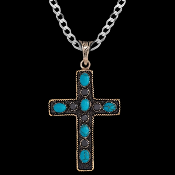 The James Cross Pendant Necklace features a german silver base with a bronze rope frame, adorned with beautfil turquoise stones. Pair it with a special discount sterling silver chain today!